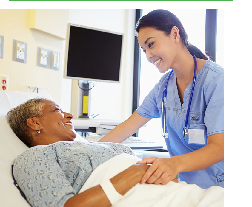 Nurse Talking to Senior Woman in Hospital Room